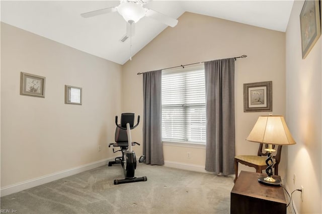 exercise area featuring ceiling fan, light colored carpet, lofted ceiling, and a healthy amount of sunlight