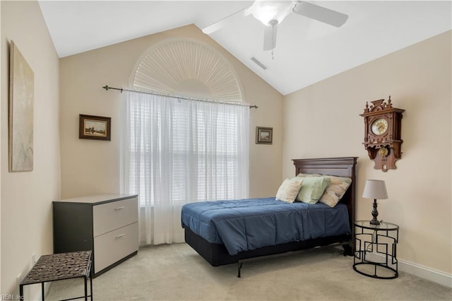 carpeted bedroom with ceiling fan, multiple windows, and lofted ceiling