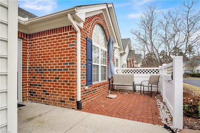 view of property exterior featuring a patio area