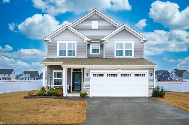 view of front facade with a garage and a front lawn