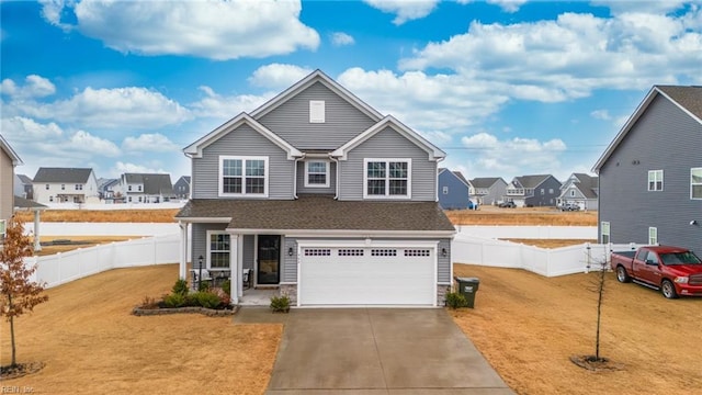 view of front of property featuring a garage and a front lawn