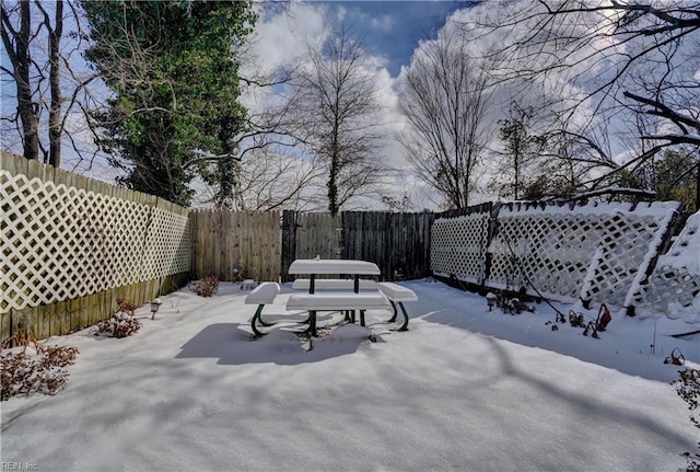 view of yard layered in snow