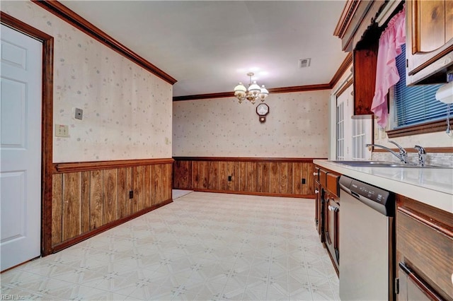 kitchen featuring stainless steel dishwasher, decorative light fixtures, sink, a notable chandelier, and ornamental molding