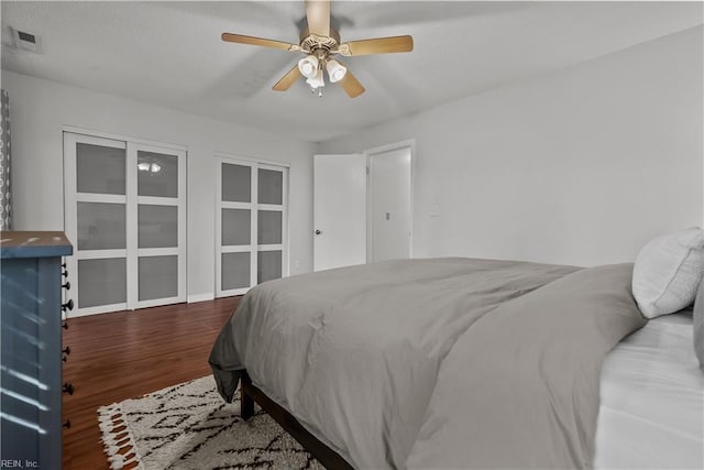 bedroom with ceiling fan and hardwood / wood-style floors