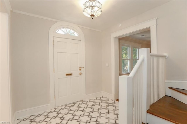 entrance foyer featuring crown molding