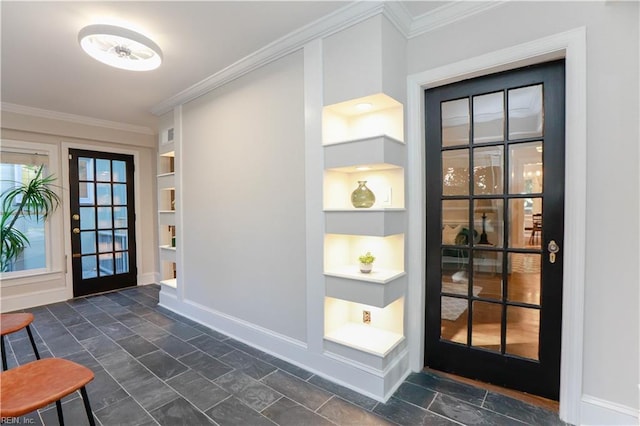 entryway featuring crown molding and built in features