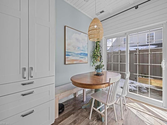 dining room with dark hardwood / wood-style flooring