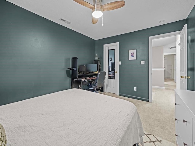 bedroom with light carpet and ceiling fan