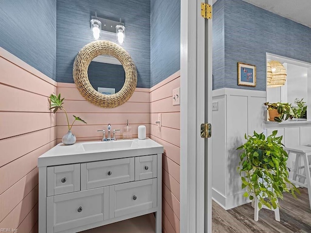 bathroom featuring hardwood / wood-style flooring and vanity