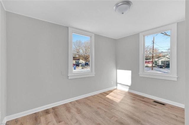 unfurnished room featuring light wood-type flooring