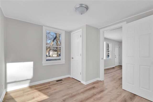 unfurnished room with light hardwood / wood-style floors