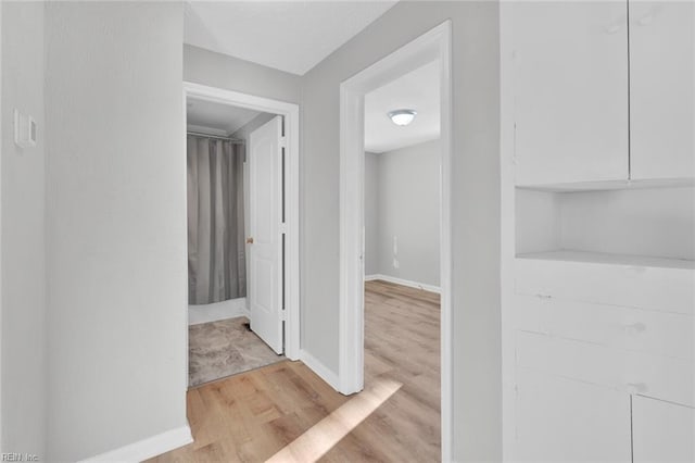 hall with light hardwood / wood-style flooring