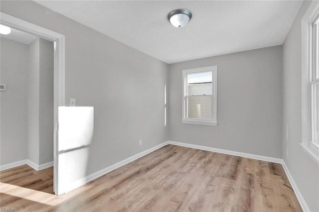 spare room with light wood-type flooring