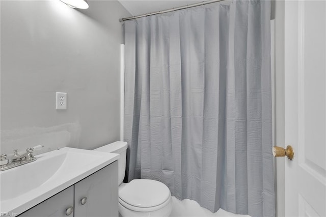 bathroom with vanity, toilet, and a shower with curtain