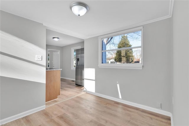 unfurnished room featuring light wood-type flooring