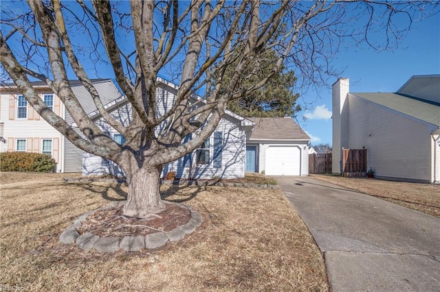 view of front facade with a garage and a front yard