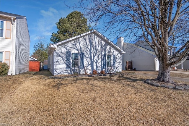 back of house featuring a yard