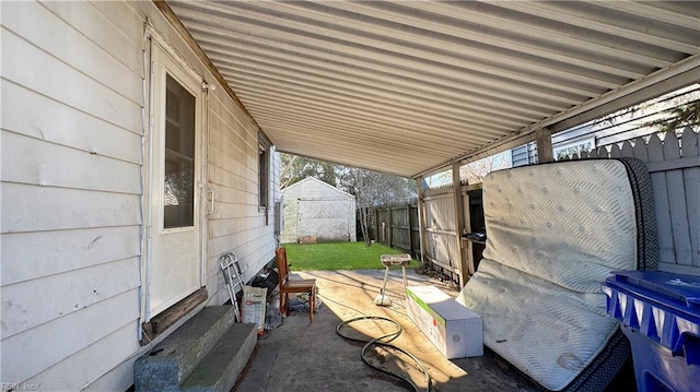 view of patio / terrace with a storage unit