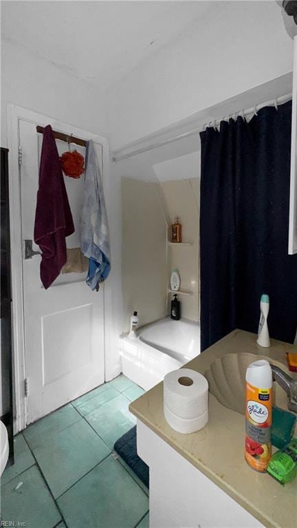 bathroom with washtub / shower combination and tile patterned floors