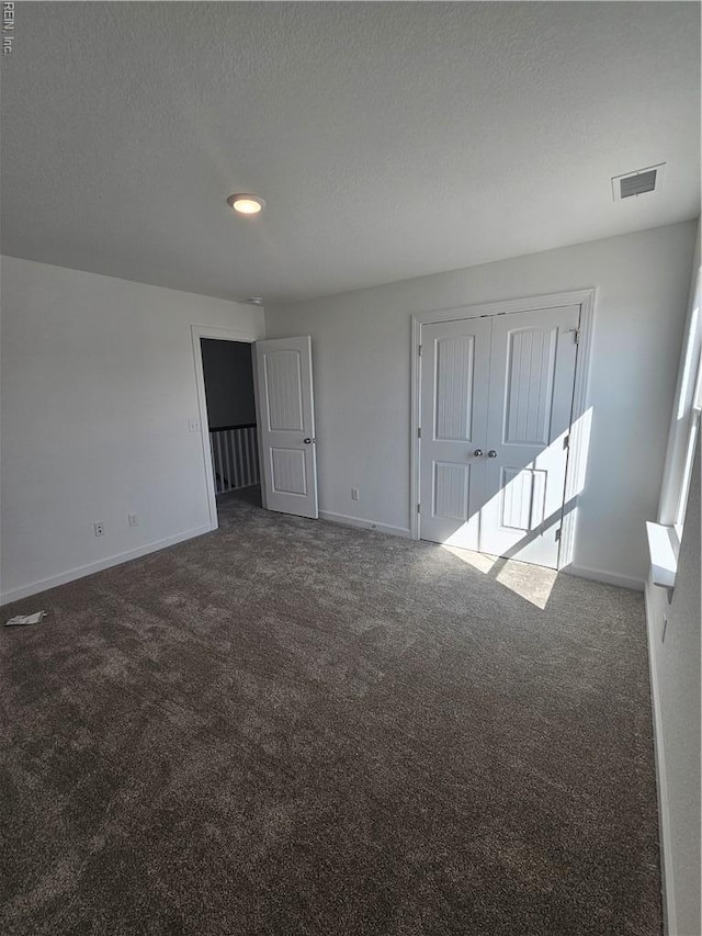 307 Iris Cir, Moyock, NC 27958 - unfurnished bedroom featuring carpet and baseboards