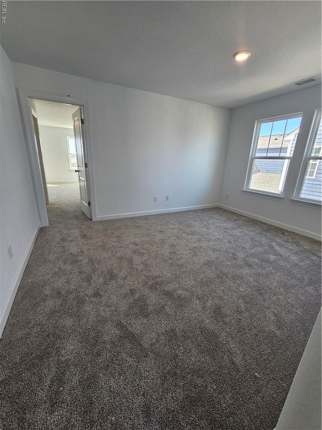 307 Iris Cir, Moyock, NC 27958 - empty room featuring carpet flooring and baseboards