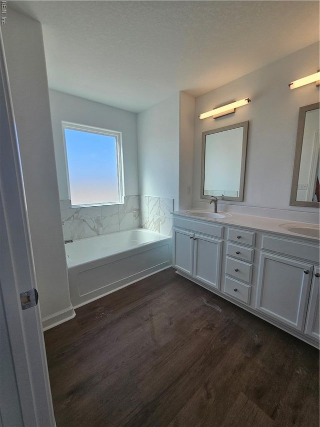 307 Iris Cir, Moyock, NC 27958 - full bath featuring wood finished floors, double vanity, and a bath