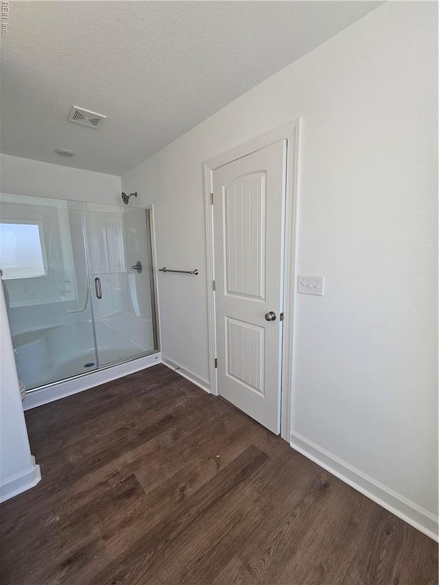 307 Iris Cir, Moyock, NC 27958 - bathroom with a shower stall, wood finished floors, and baseboards