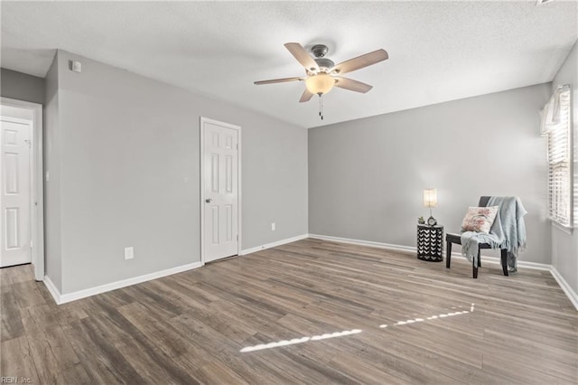 unfurnished room with hardwood / wood-style flooring and ceiling fan