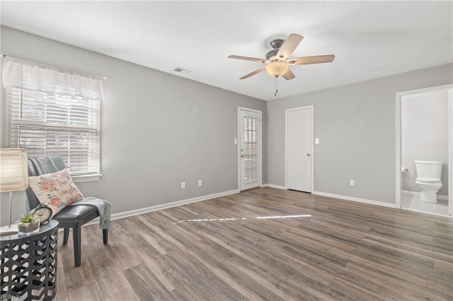 unfurnished room featuring hardwood / wood-style flooring and ceiling fan