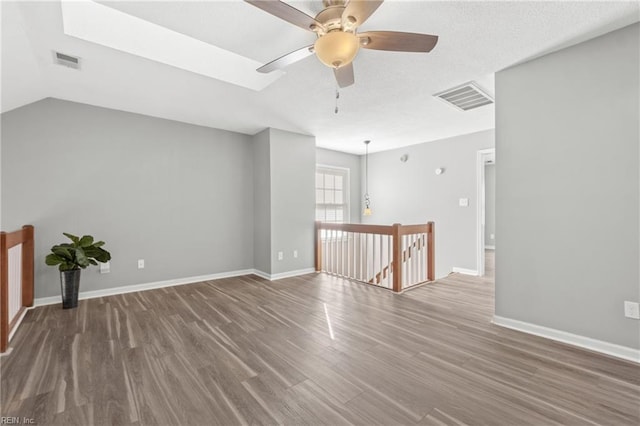 unfurnished room with hardwood / wood-style floors and ceiling fan