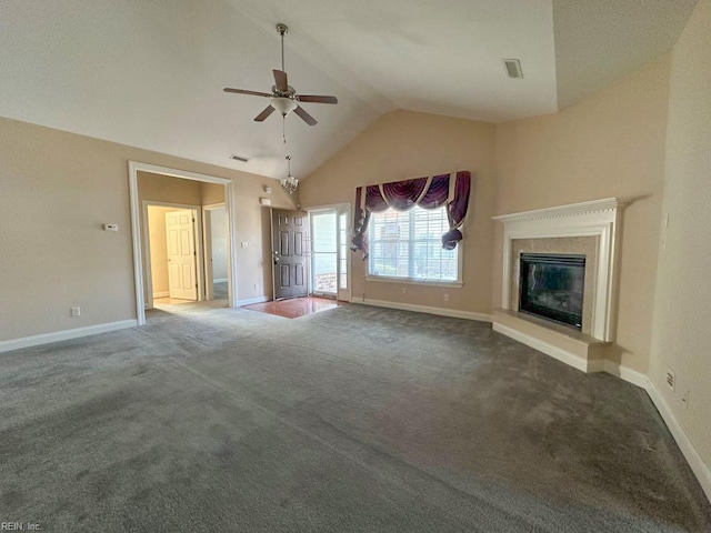 unfurnished living room featuring vaulted ceiling, dark carpet, and ceiling fan