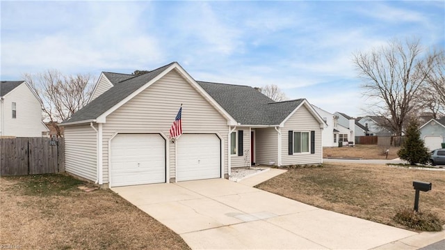 view of front of house with a front yard and a garage