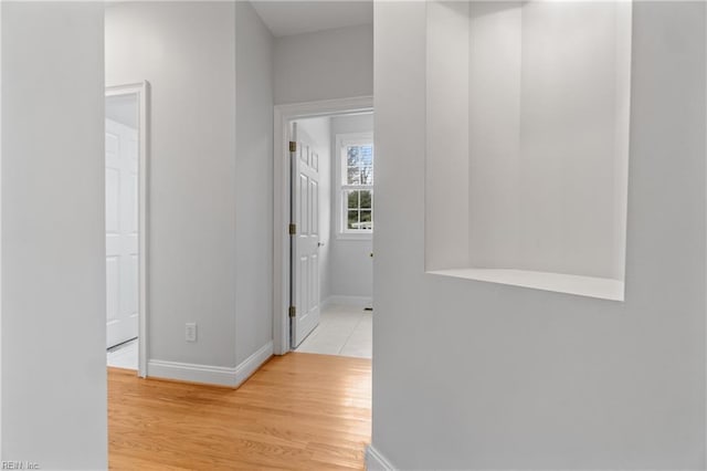 hall with light hardwood / wood-style flooring