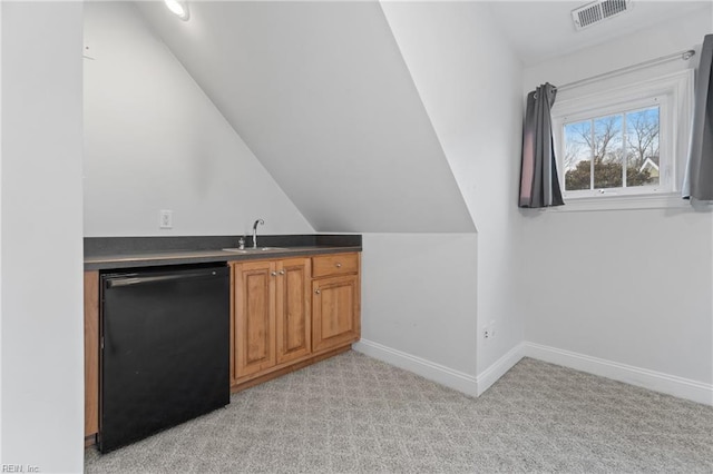 bar featuring refrigerator, black dishwasher, light carpet, sink, and vaulted ceiling