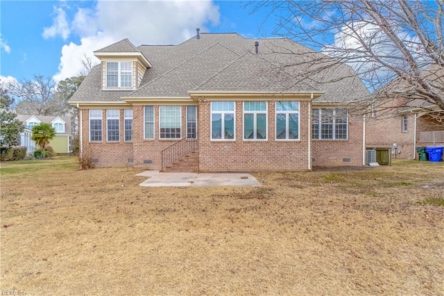 back of property featuring a patio area and a lawn