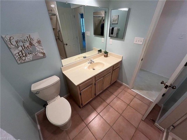 bathroom with tile patterned floors, vanity, and toilet