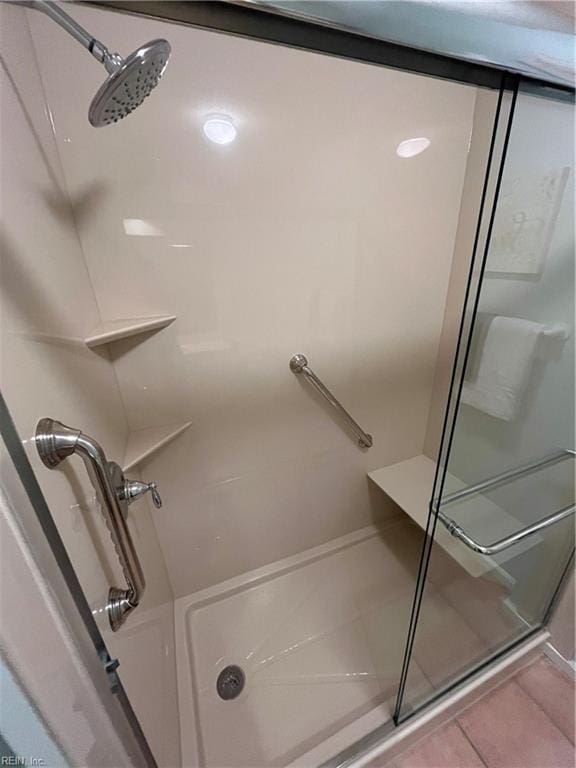 bathroom featuring tile patterned flooring and a shower