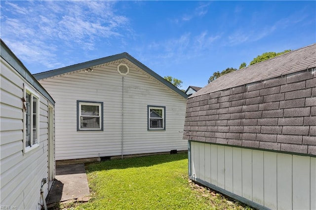 view of home's exterior with a yard