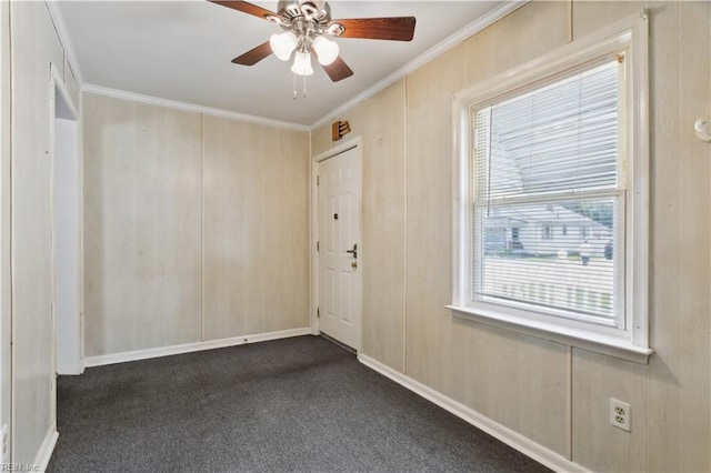 carpeted empty room with crown molding and ceiling fan