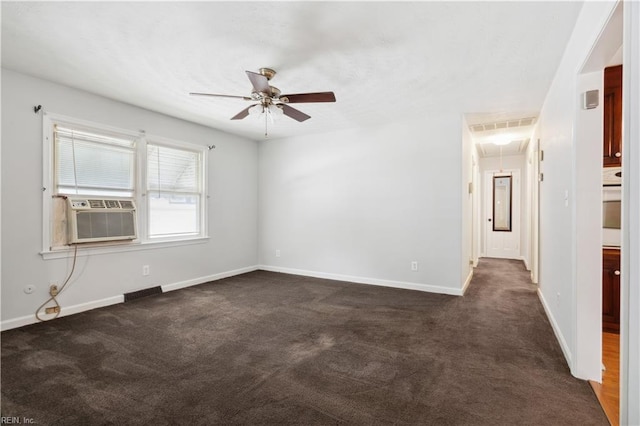 spare room with ceiling fan, cooling unit, and dark carpet