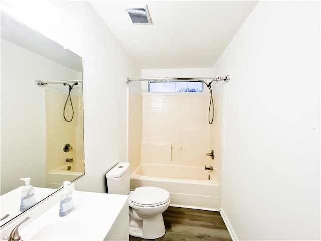 full bathroom featuring vanity, wood-type flooring, shower / tub combination, and toilet