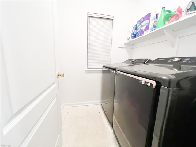 clothes washing area featuring washer and dryer