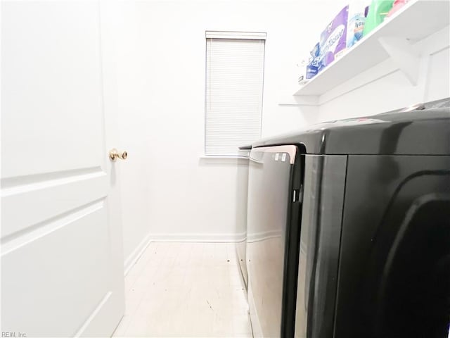 washroom featuring independent washer and dryer