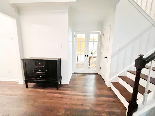 entrance foyer featuring french doors and dark hardwood / wood-style floors