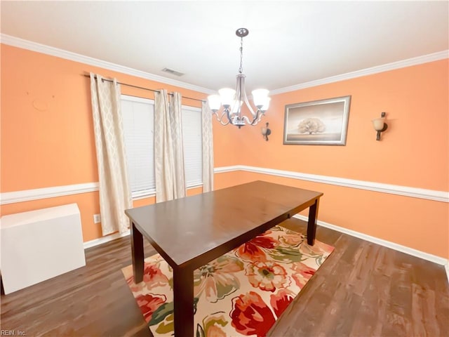 dining room with ornamental molding and dark wood-type flooring