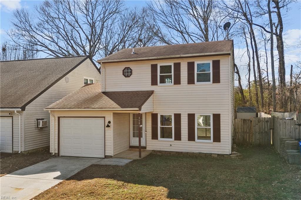 view of front facade with a garage and a front yard