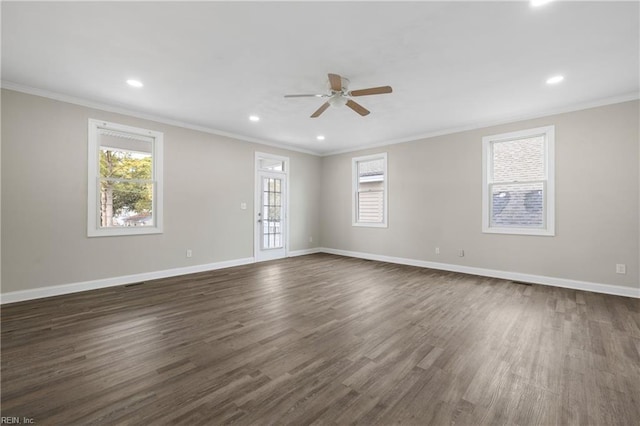 unfurnished room with ceiling fan, crown molding, dark hardwood / wood-style floors, and a healthy amount of sunlight