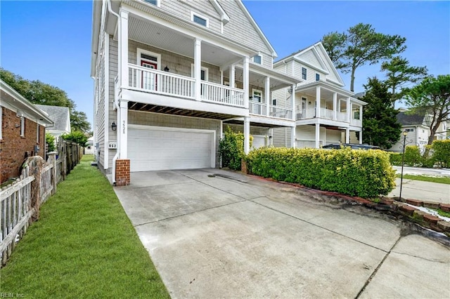 view of front of house featuring a balcony and a garage