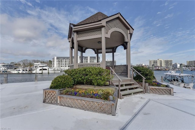 view of home's community featuring a gazebo and a water view