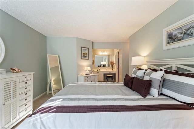 carpeted bedroom featuring a textured ceiling